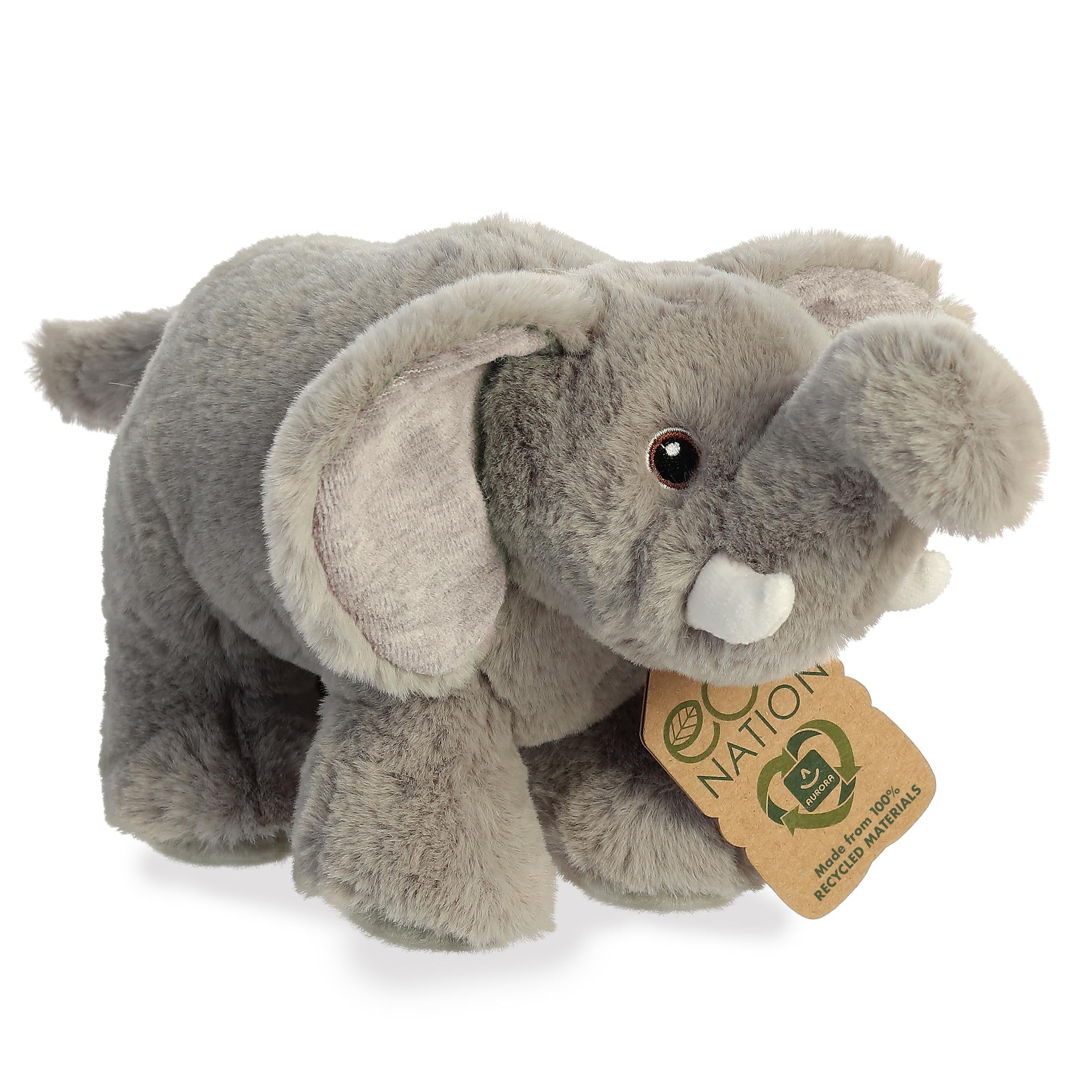 A lovable elephant plush resembling the real animal with a grey coat, trunk, two soft plush tusks, and an eco-nation tag