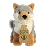 A cute wolf plush with grey, white, and tan fur, embroidered eyes, and an eco-nation tag around its neck