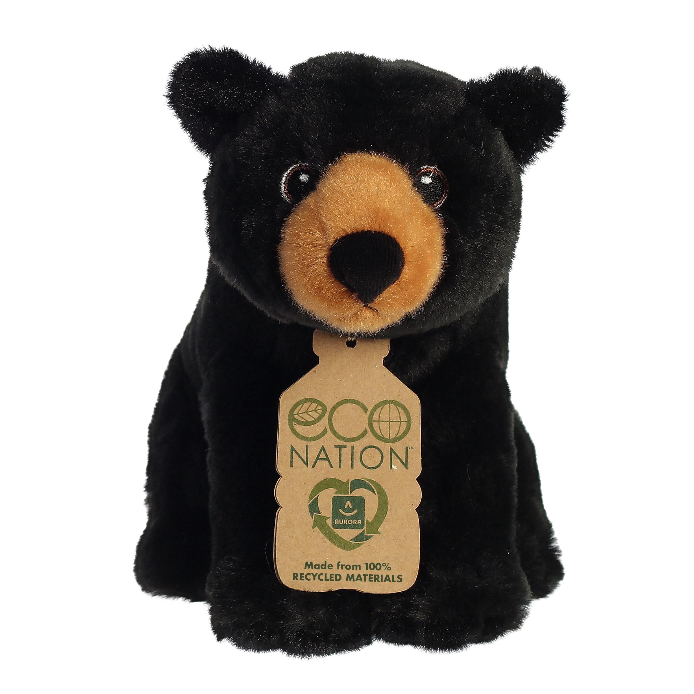 A delightful black bear plush with a rich black coat, brown snout, embroidered eyes, and an eco-nation tag around its neck