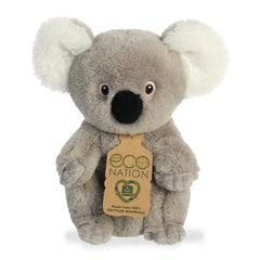 A cute koala plush with a grey coat and fluffy white ears, fun embroidered eyes, and an eco-nation tag around its neck