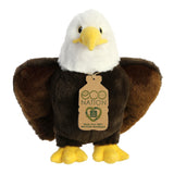 A captivating eagle plush with brown and white coat resembling feathers, embroidered eyes, and an eco-nation tag