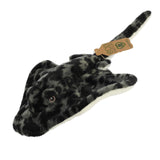 An enchanting stingray plush with a dark array of patterns, embroidered eyes, and an eco-nation tag around its tail