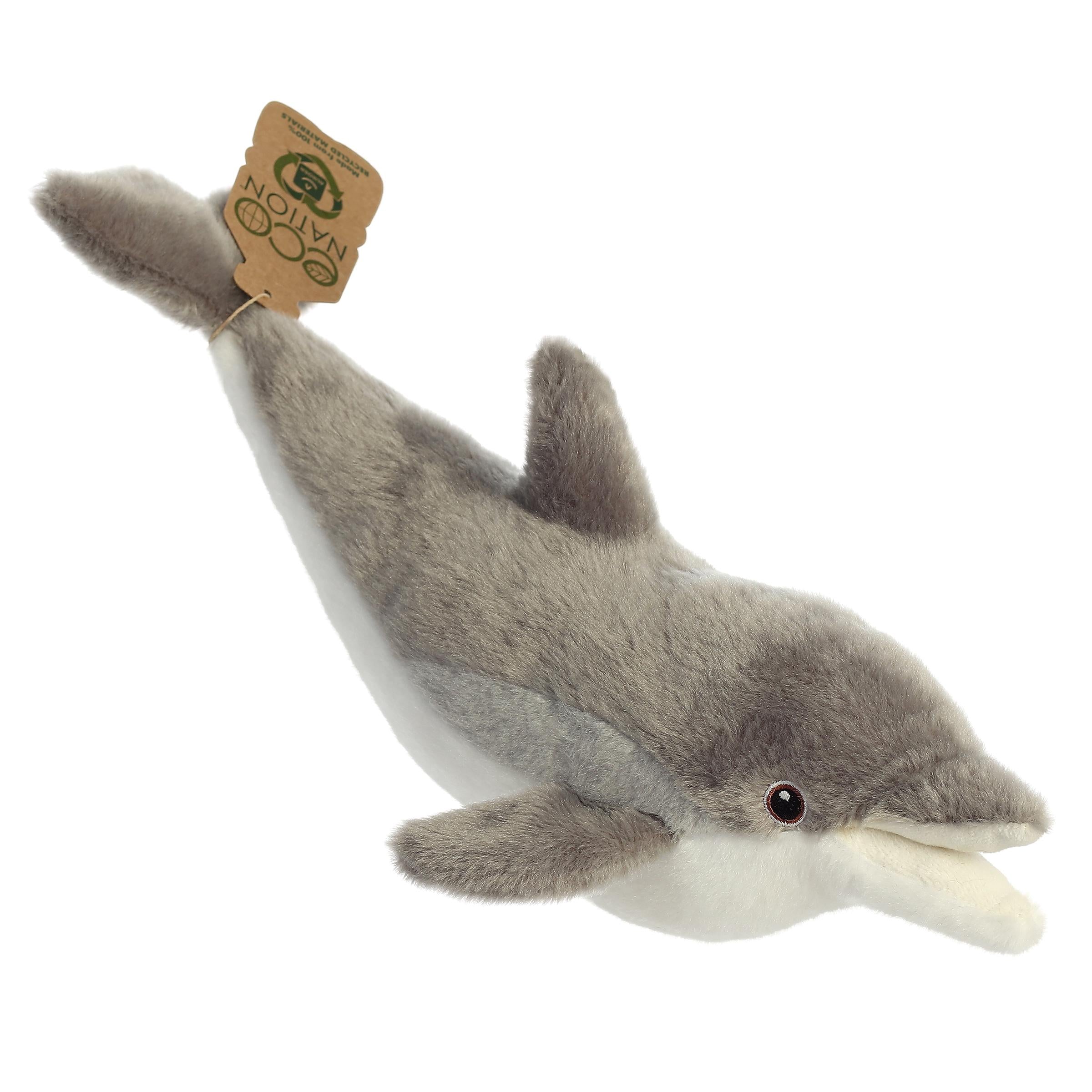 A whimsical dolphin plush with a grey and white coat, gentle embroidered eyes, and an eco-nation tag around its tail