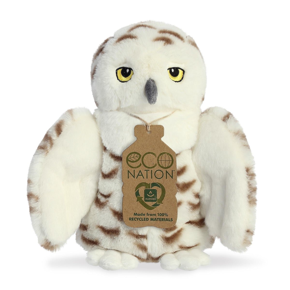A magical owl plush that has a white and brown coat resembling feathers, gentle embroidered eyes, and an eco-nation tag