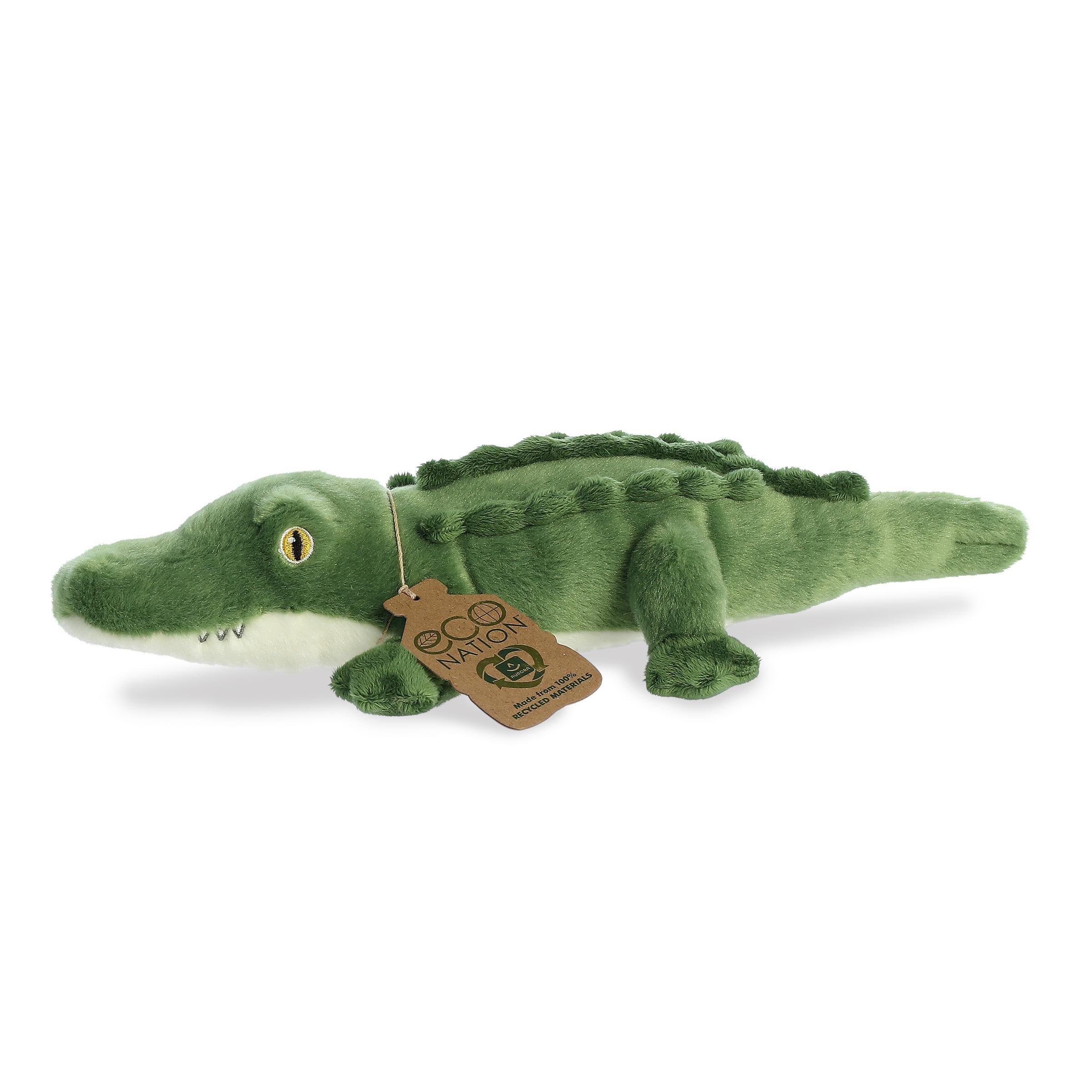 Irresistible alligator plush with a body made of shades of green, embroidered eyes, and an eco-nation tag