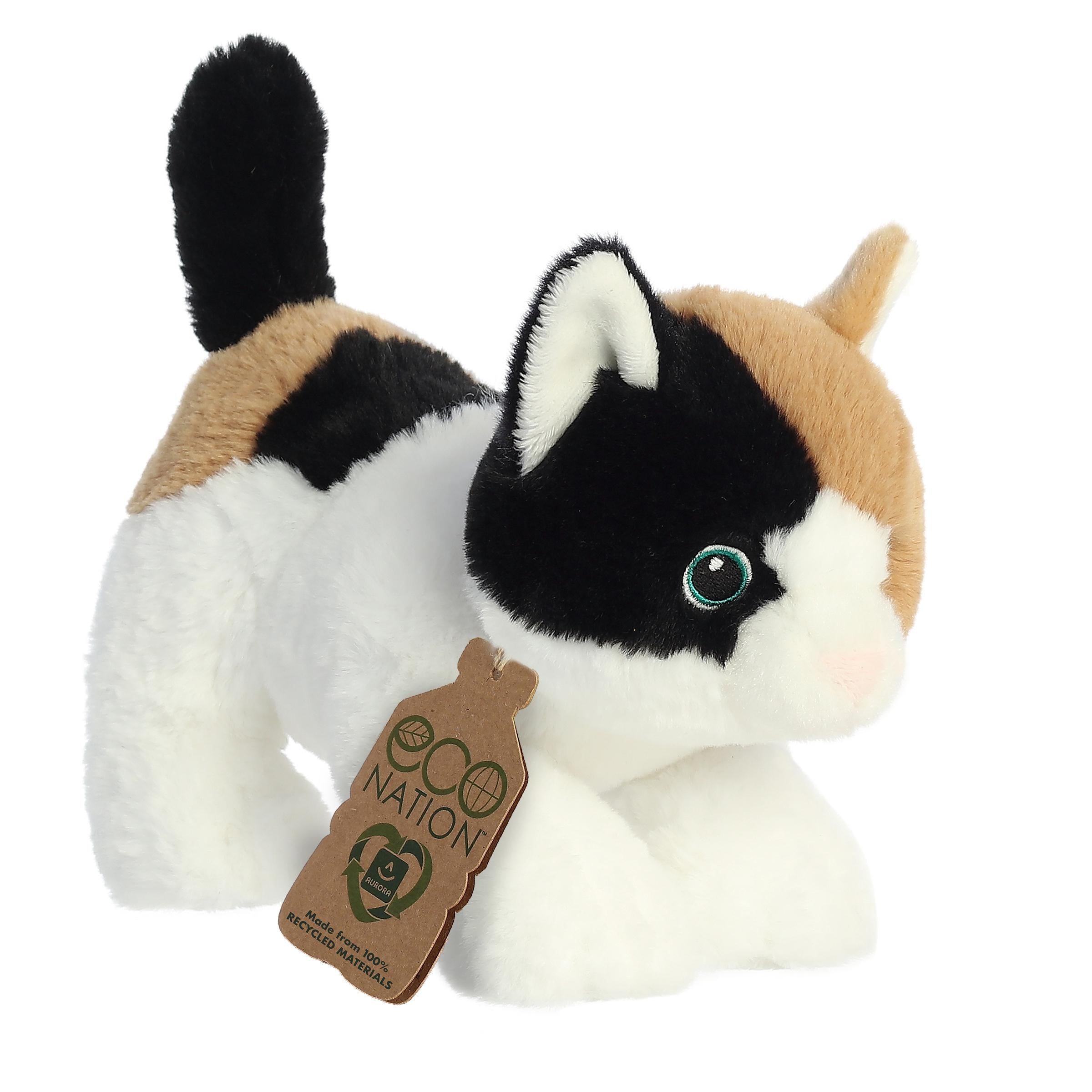 A lovely calico cat plush with a white, brown, and black coat, delicate embroidered eyes, and an eco-nation tag