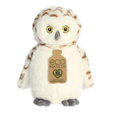 An enchanting snowy owl plush that has white fur with brown feathers, embroidered yellow eyes, and an eco-nation tag