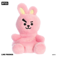 Adorable mini BT21 plush toy with a fluffy pink fur body, yellow accents on ears, and black accents on a smiling face