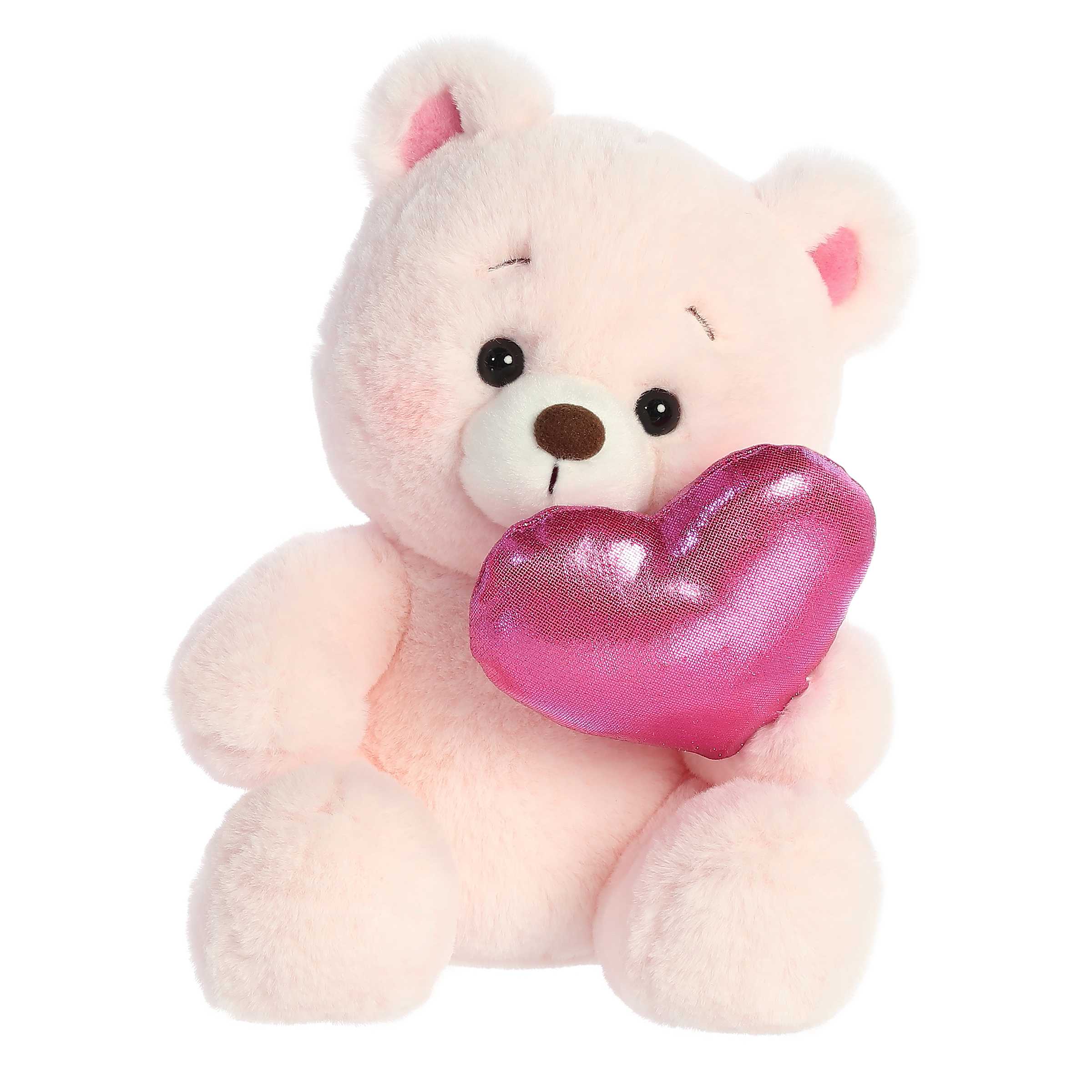 Soft, pink-furred Bashful Bear plush, holding a red heart and blushing, embodying charm and affection for Valentine's Day