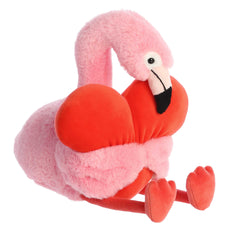 Flamingo plush from Heart Huggers, adorned in pink fur, hugging an oversized heart, makes a perfect Valentine's gift.