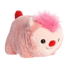 Monster plush with vibrant pink body, red mohawk, tail, and playful horns, showcasing the signature Spudsters roundness
