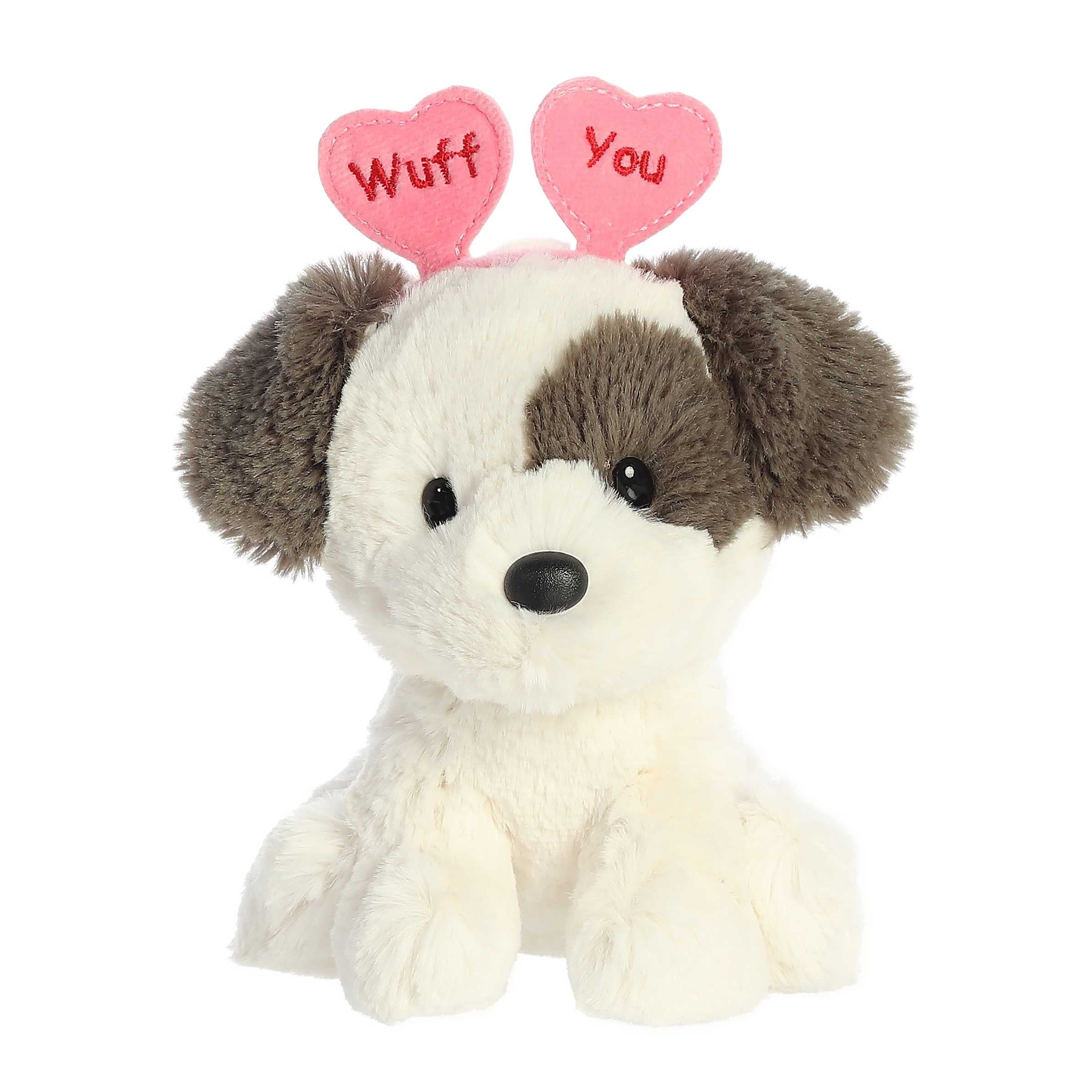 Terrier plush from Love On The Mind, adorned with a 'Wuff You' heart headband, capturing the essence of loving affection