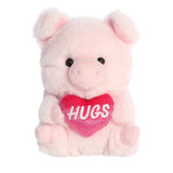 Charming perfectly pink Pig plush from Rolly Pets, sitting with a ‘Hugs’ heart, ready to share love and warm embraces.