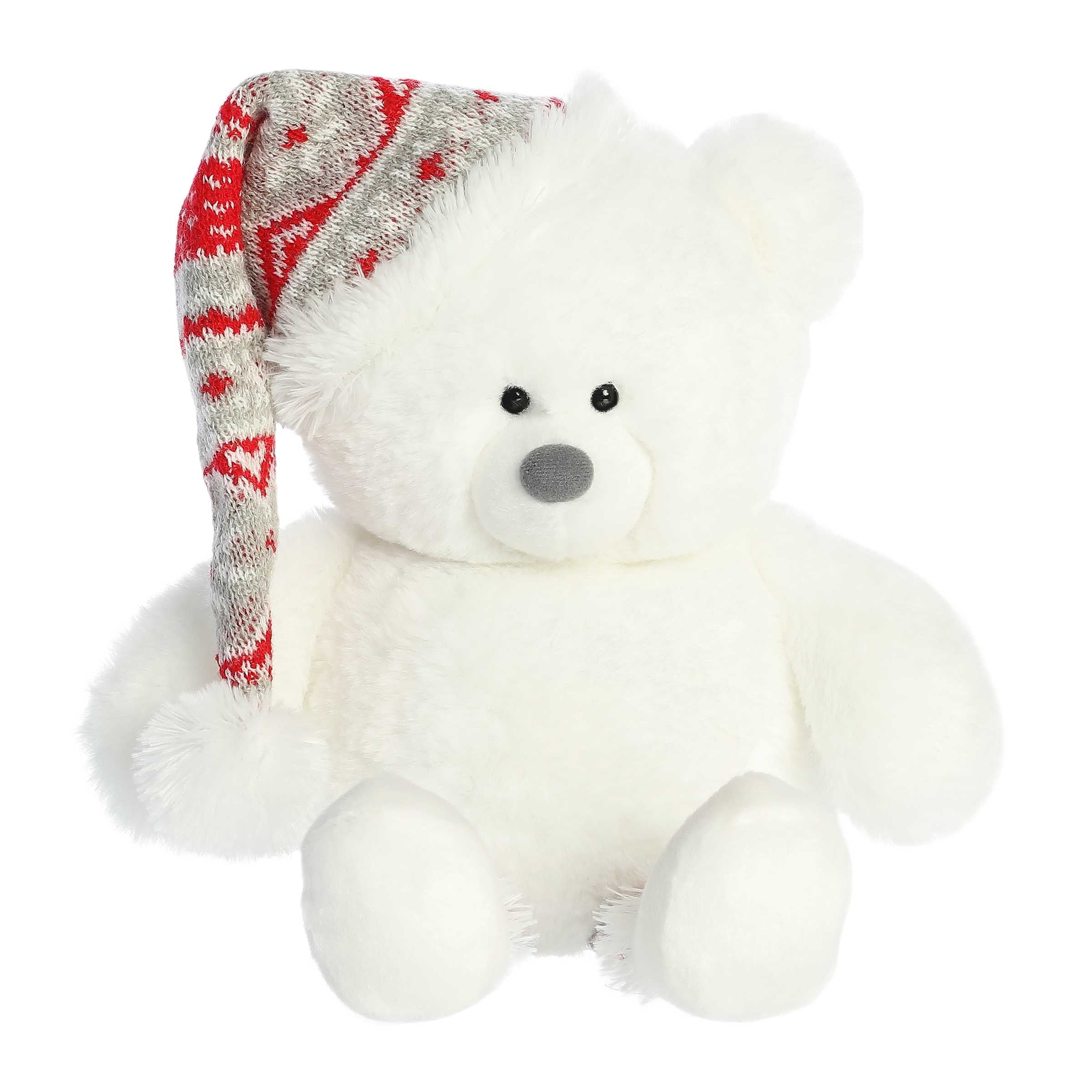 Cuddly white teddy bear with red and gray knit sweater pattern on the legs and a matching non-detachable knit Santa hat