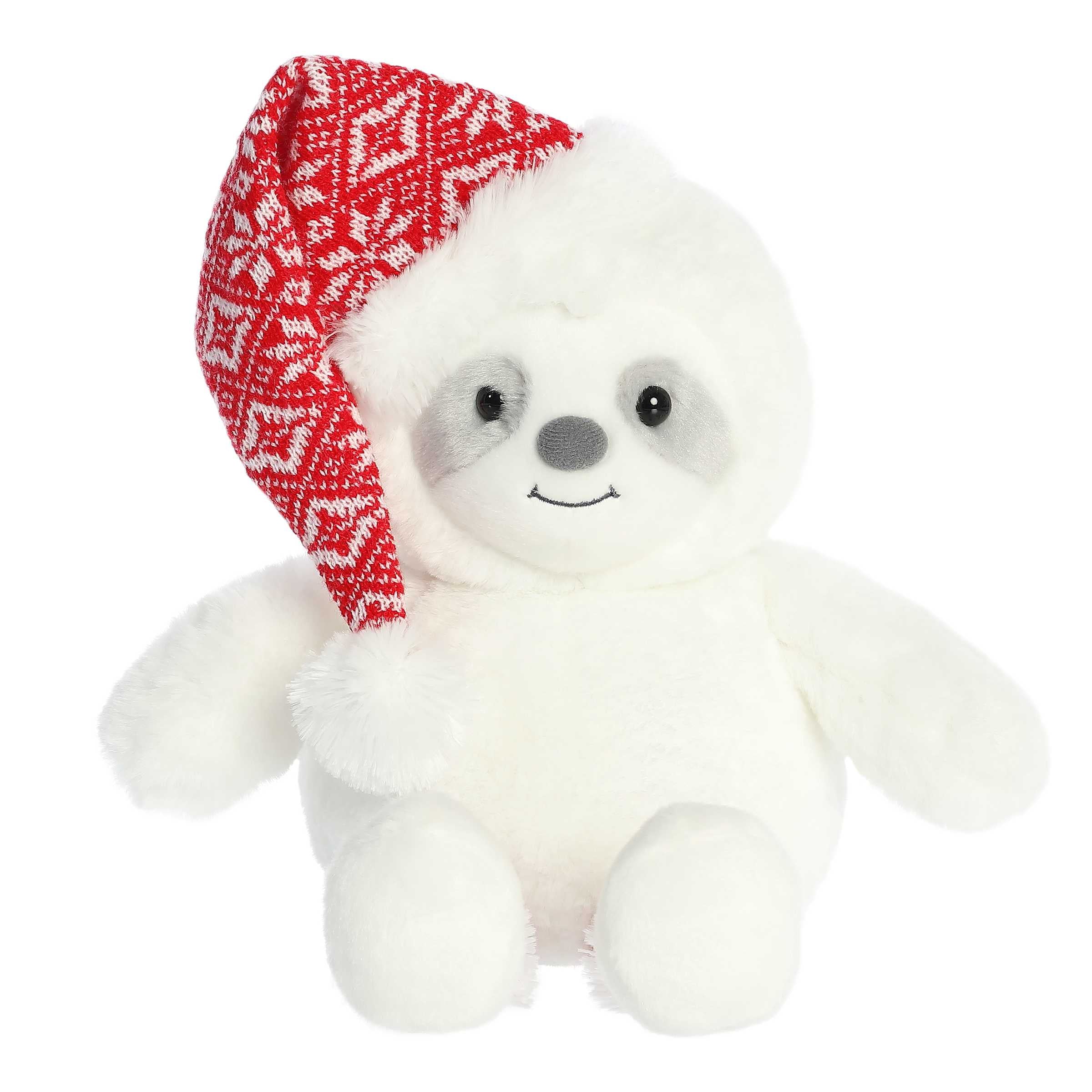 Cuddly white sloth with red and white knit sweater pattern on the legs and a matching non-detachable Santa hat