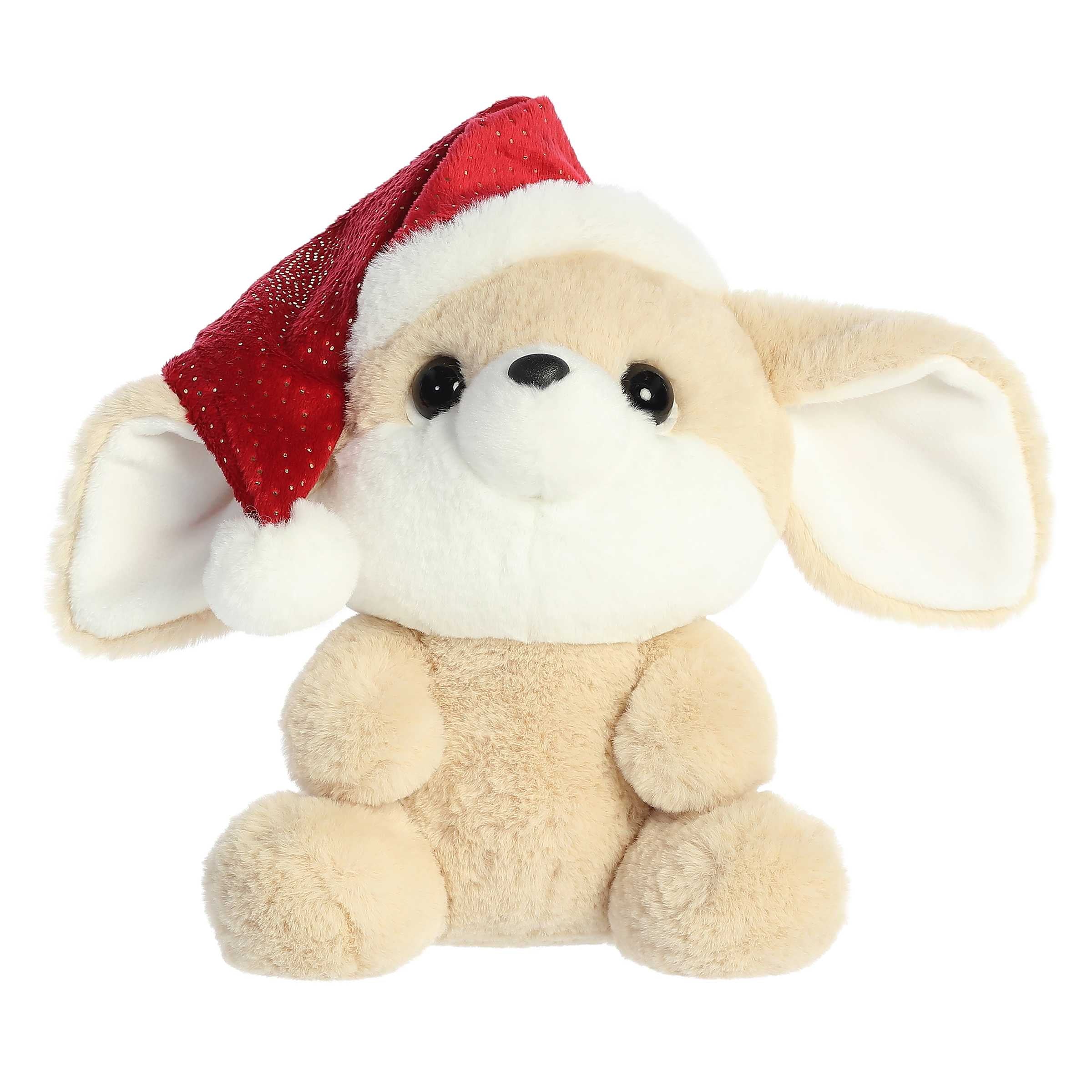 Cream fennec fox stuffed animal with endering eyes wearing a Santa hat that slides off one side of its big head