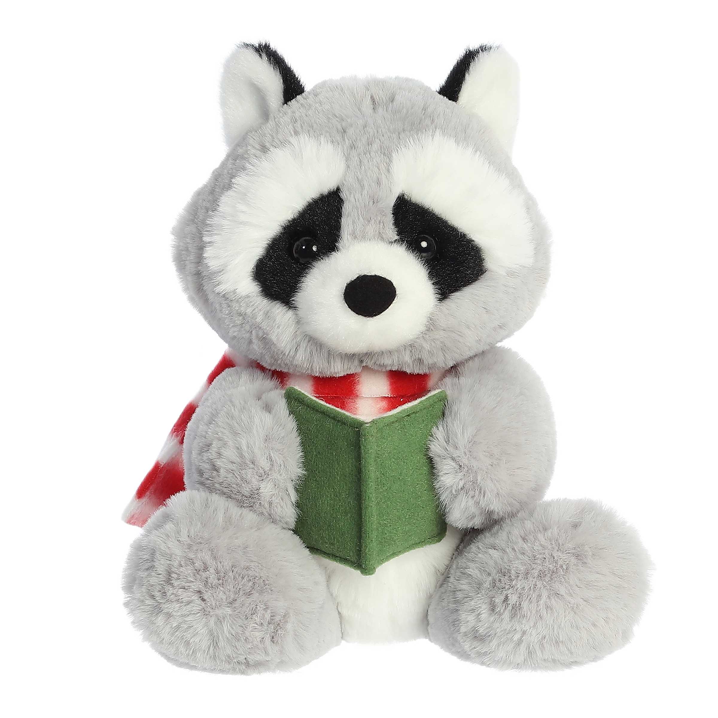 Adorable gray raccoon stuffed animal wearing a cozy red and white striped scarf and holding an open green songbook