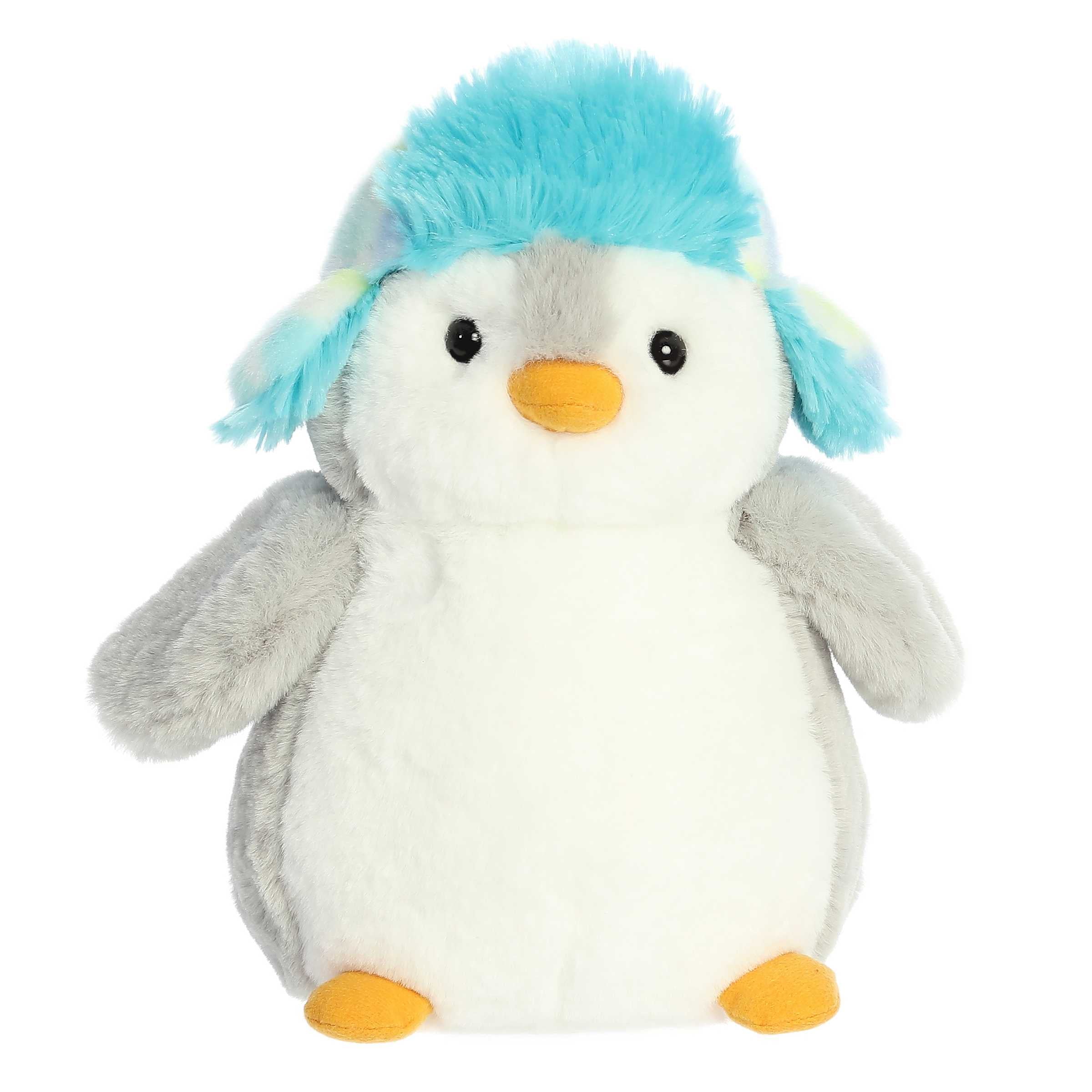 Gray back and white front stubby penguin stuffed animal wearing a blue ushanka hat with fluffy blue trim