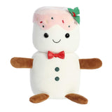 Happy white snowman plushie with tiny brown arms and legs dripping pink frosting from their head topped with a holly leaf