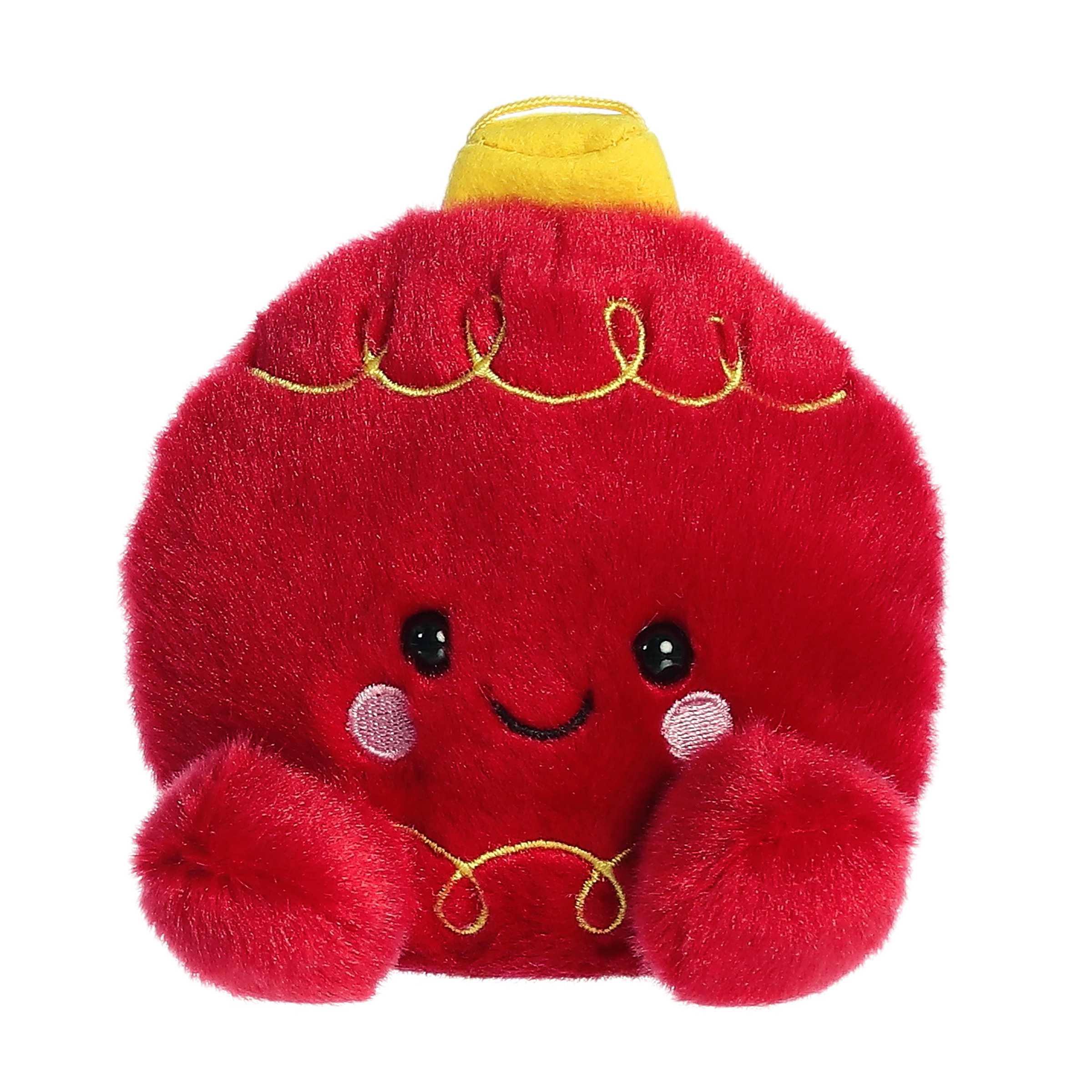 Adorable, happy, mini red ornament plush toy sitting with yellow decoration and accents