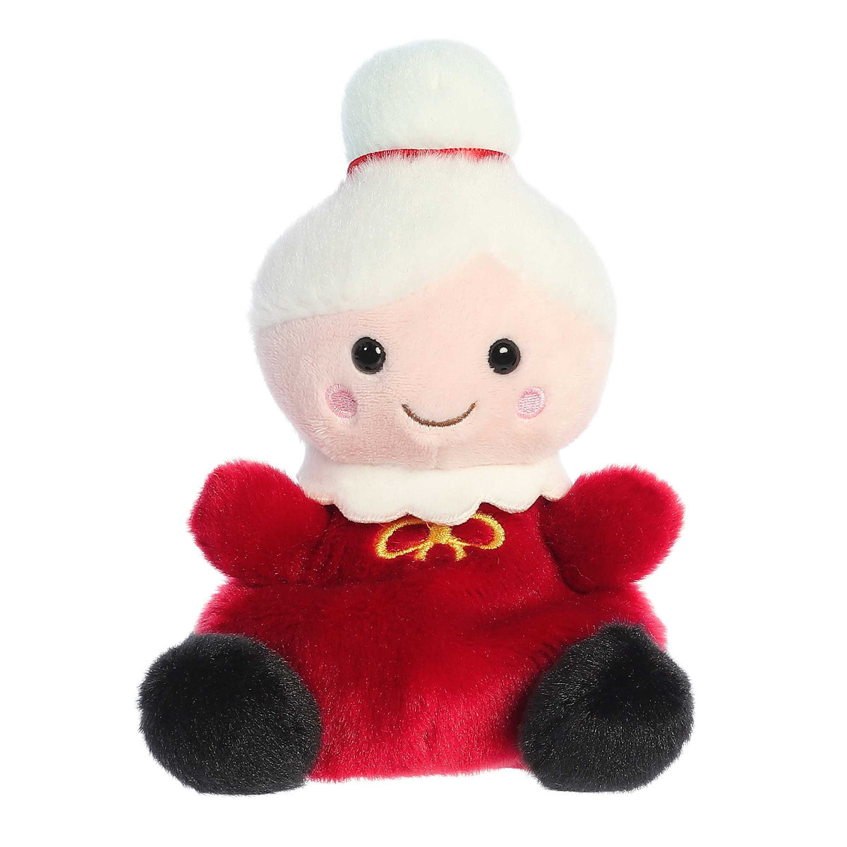 Adorable, happy, mini Mrs.Claus stuffed doll sitting, wearing a red dress and black shoes